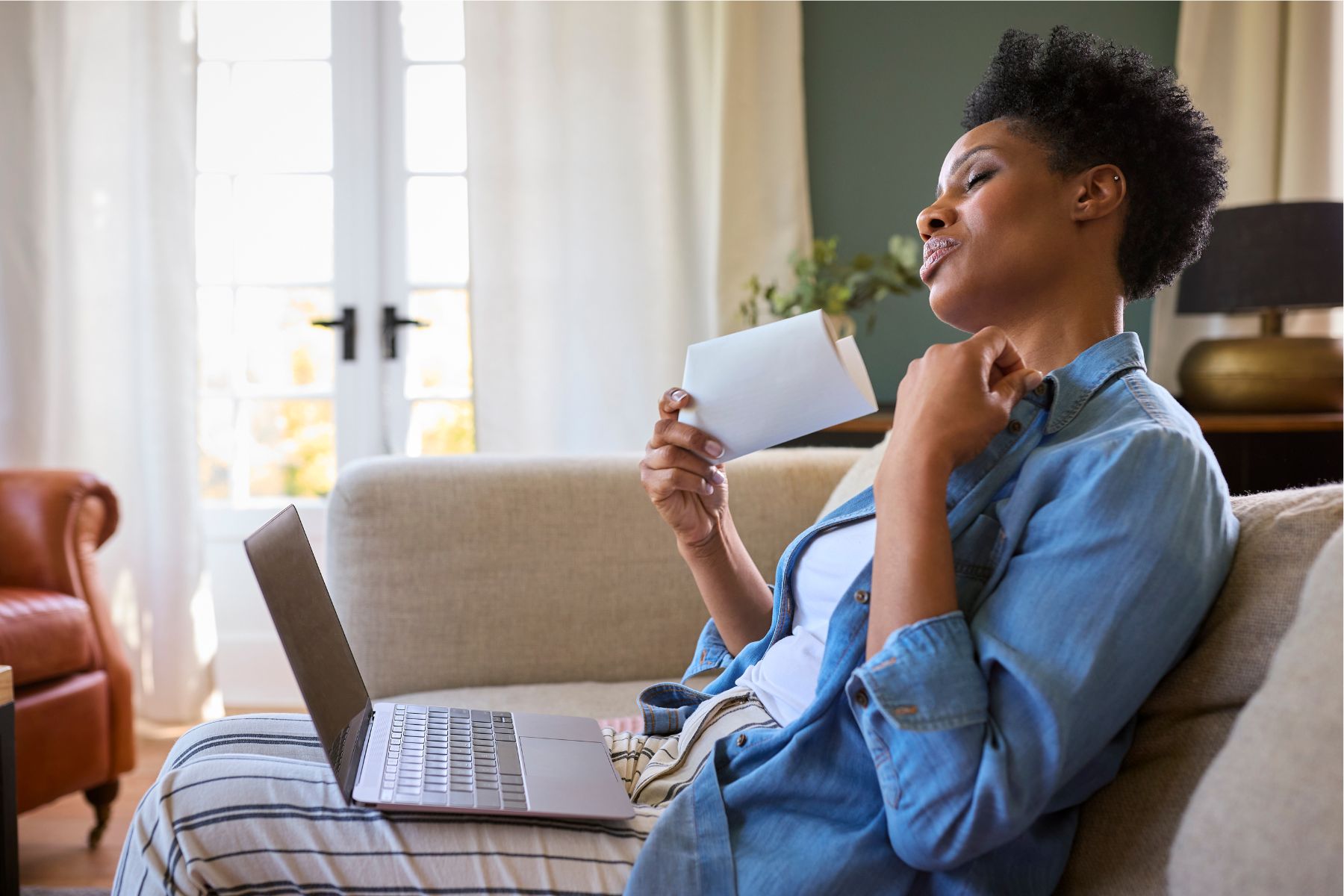 MTPR_1_Menopausal_Woman_having_hot_flash_by_Monkey_Business_Images_Canva.jpg